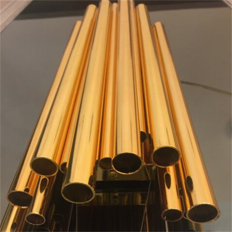 Lámpara de pared Brubeck de aluminio dorado