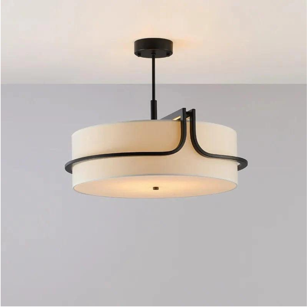 Lámpara colgante de estilo moderno instalada en un entorno interior minimalista.