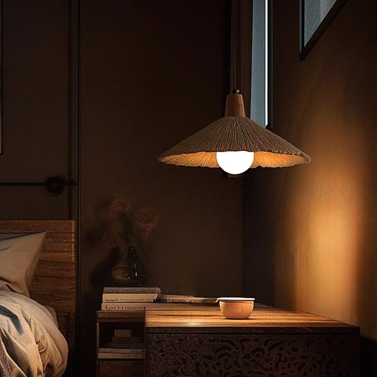 Zapalona cementowa lampa wisząca w ciemnej scenie sypialni