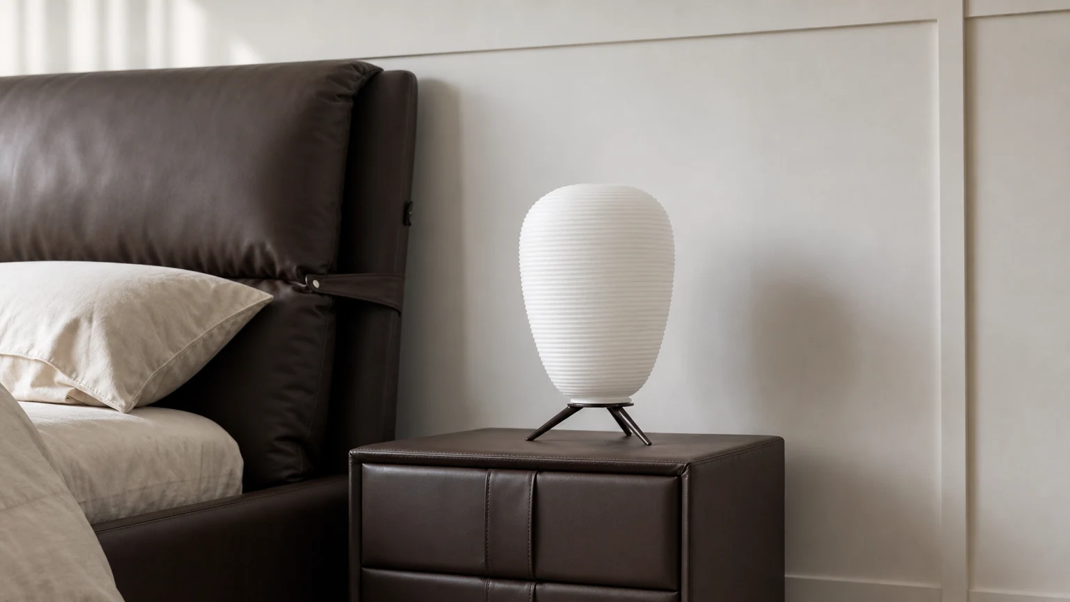 Horizontal bedroom scene with white tripod lamp