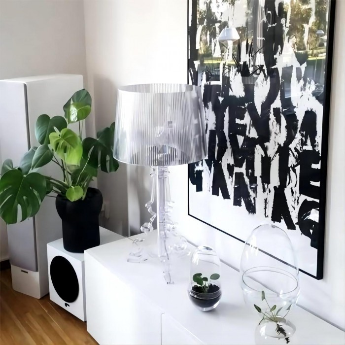 Clear Bourgie lamp on white cabinet