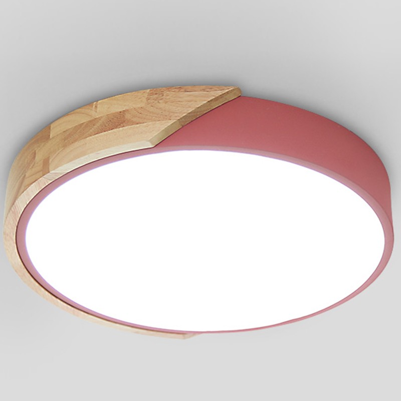 Primer plano del borde rosa de ARTRA y el detalle de madera.