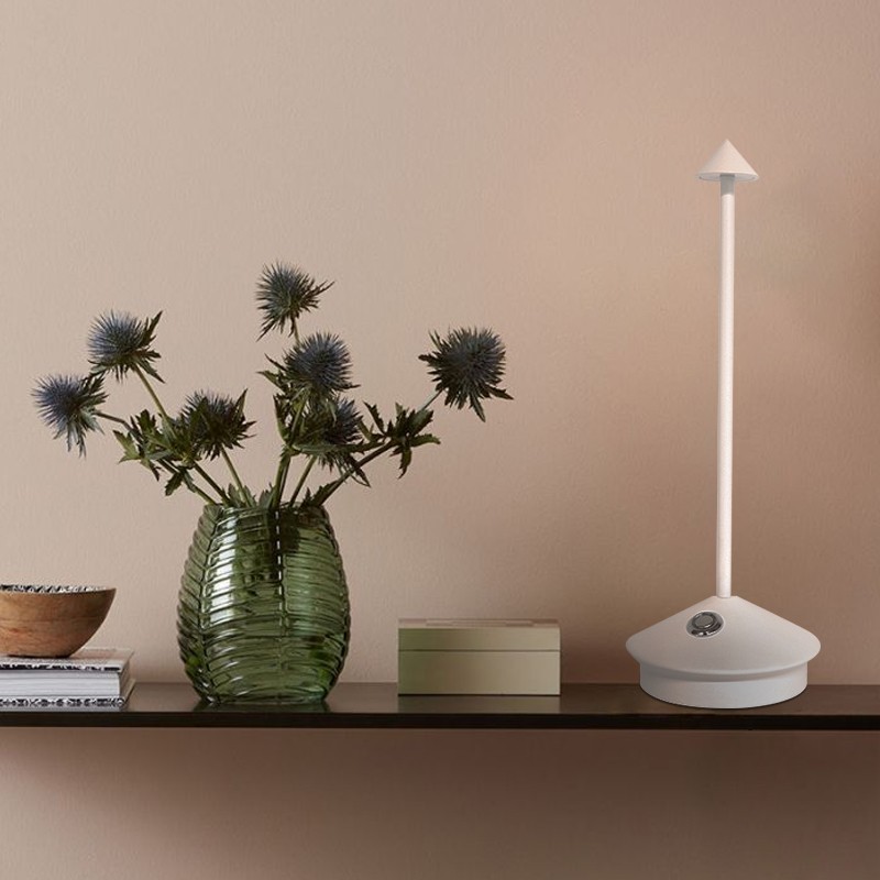 White Pina lamp on a shelf with vase and decor