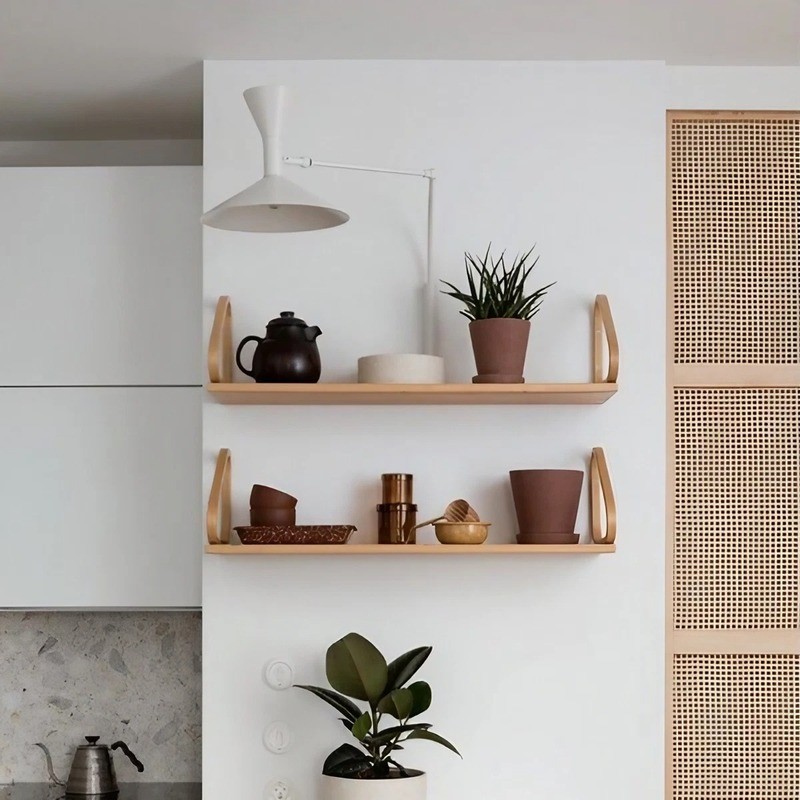 White adjustable wall lamp in shelving or kitchen interior scene