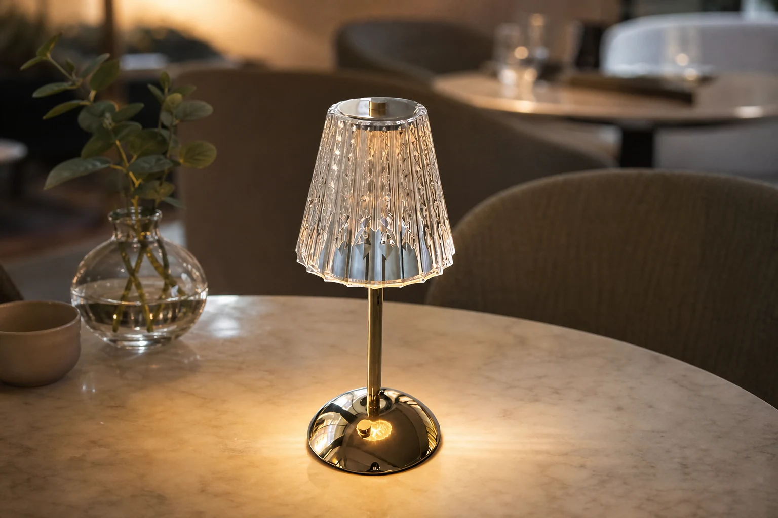 Lifestyle setting with the pleated brass cordless table lamp centered