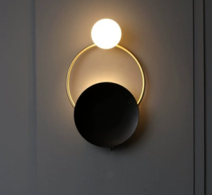 GRISK Luxe Wall Lamp lit on a dark wall
