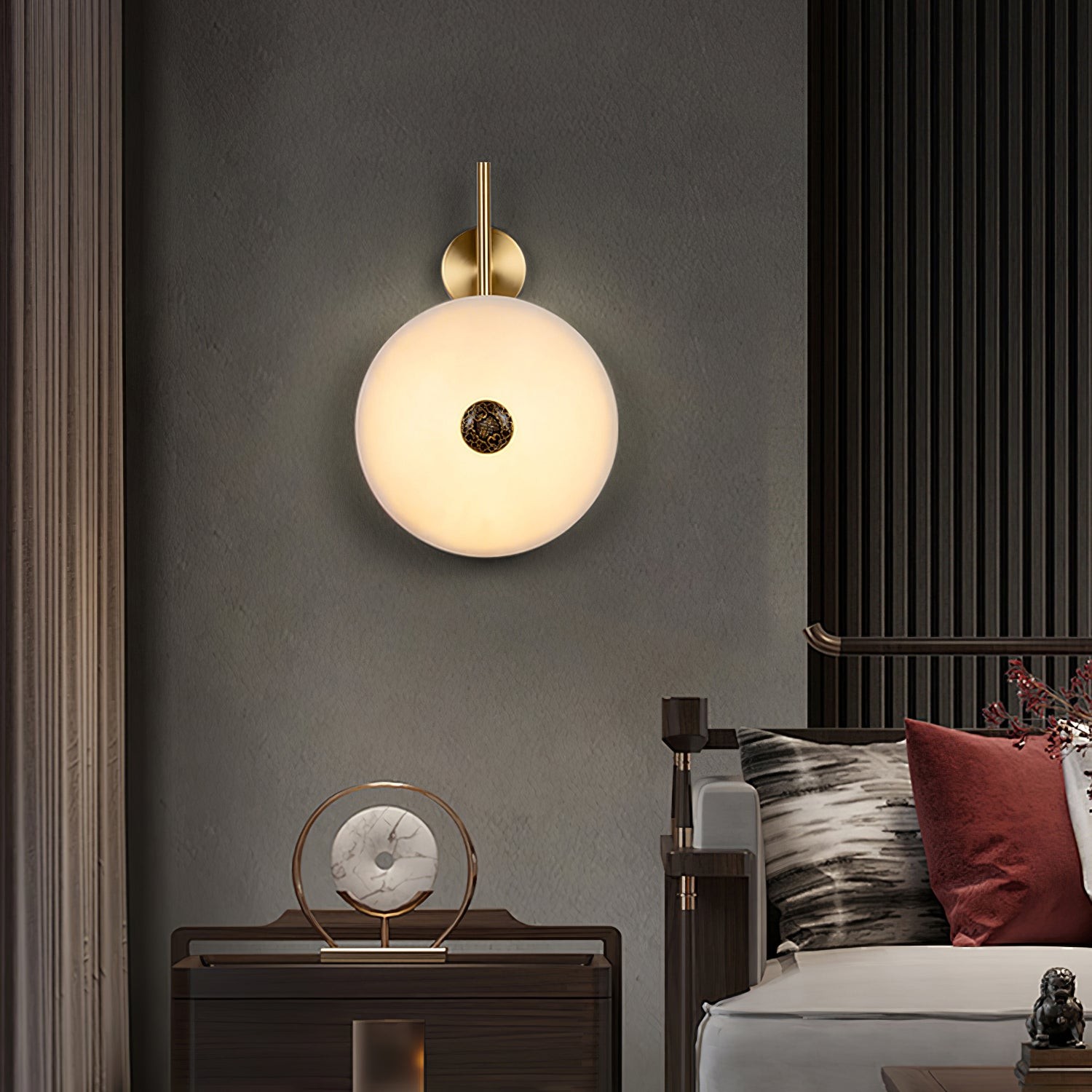 Single-disc wall lamp mounted above a side table