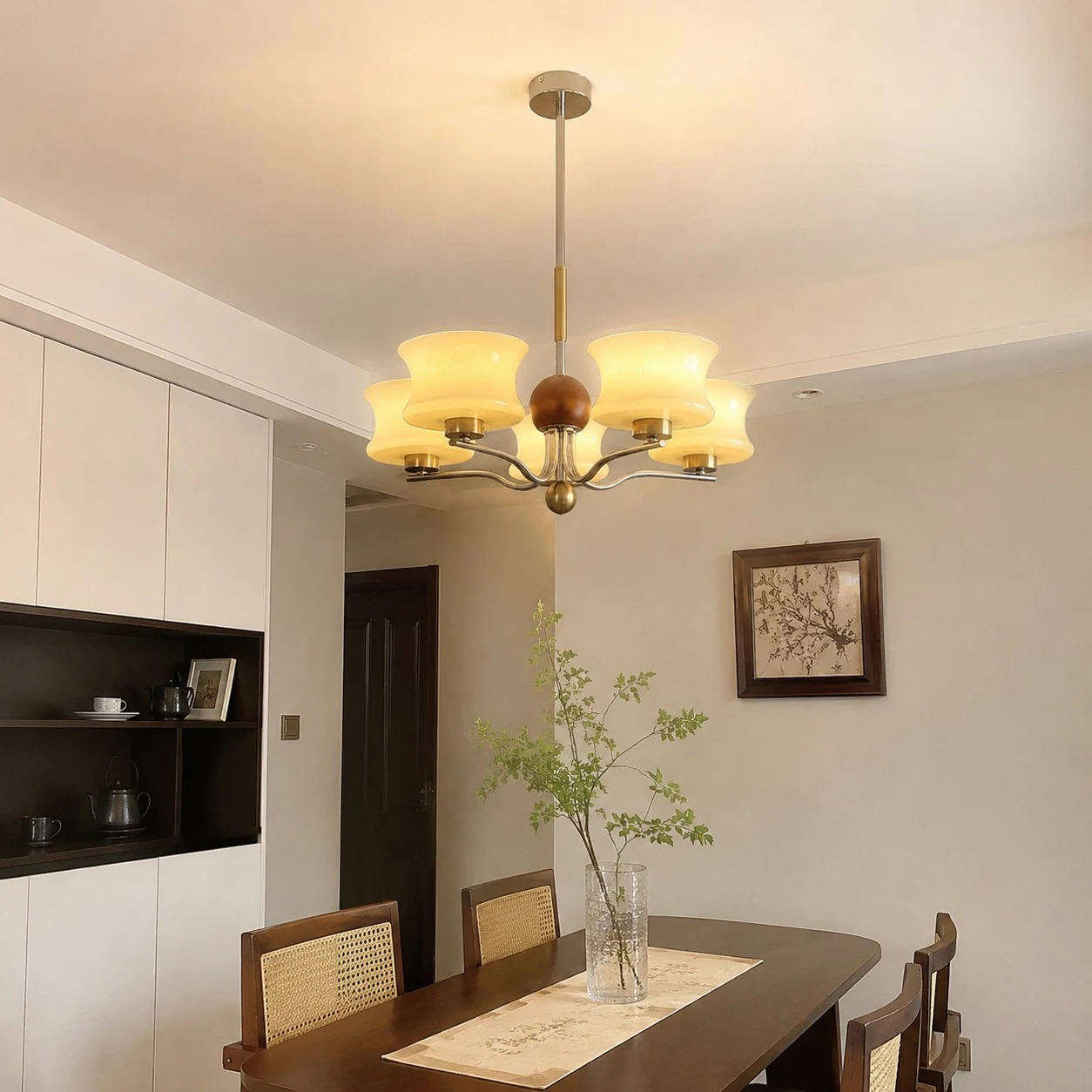 Cream glass chandelier over a dining table