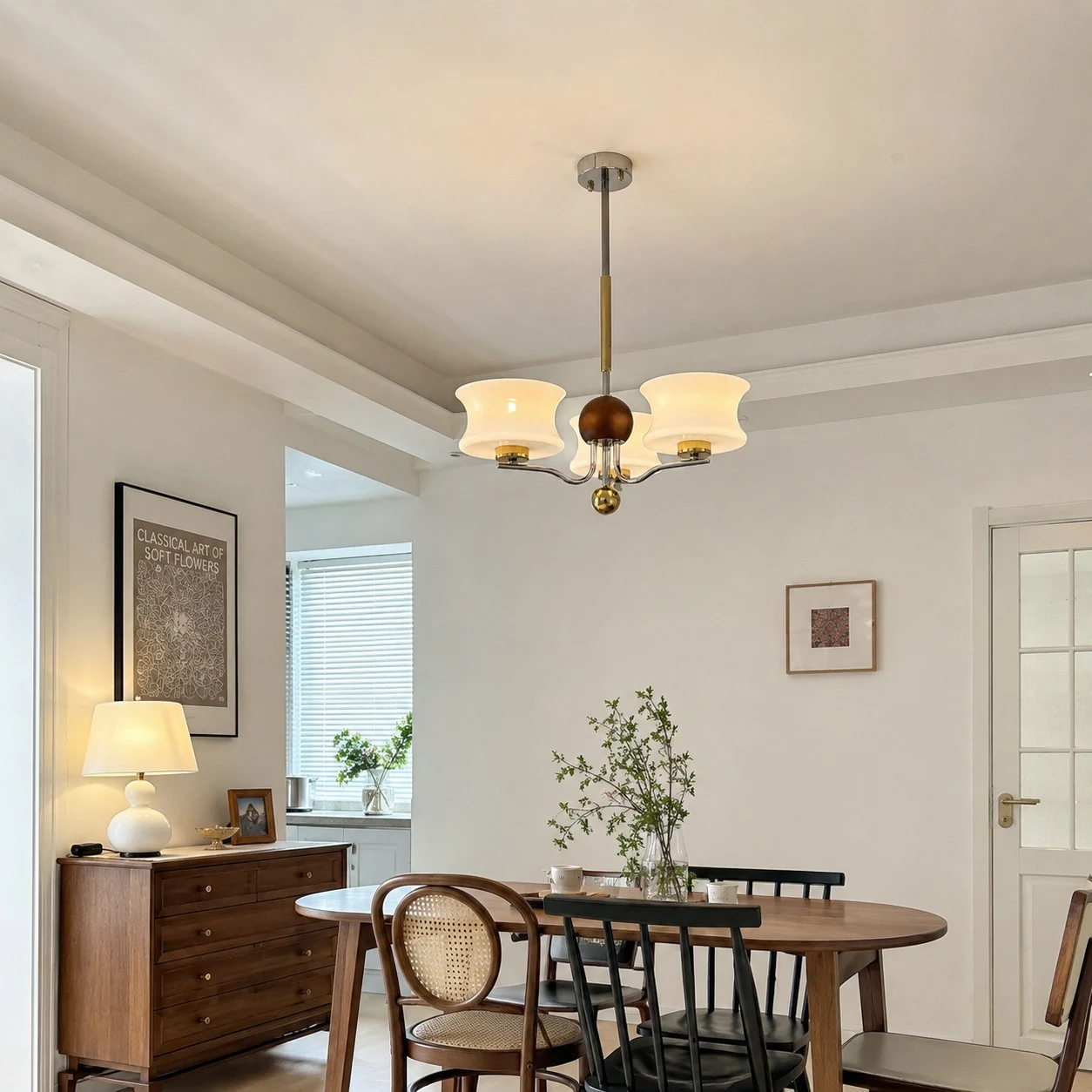 Cream glass chandelier above a round dining table