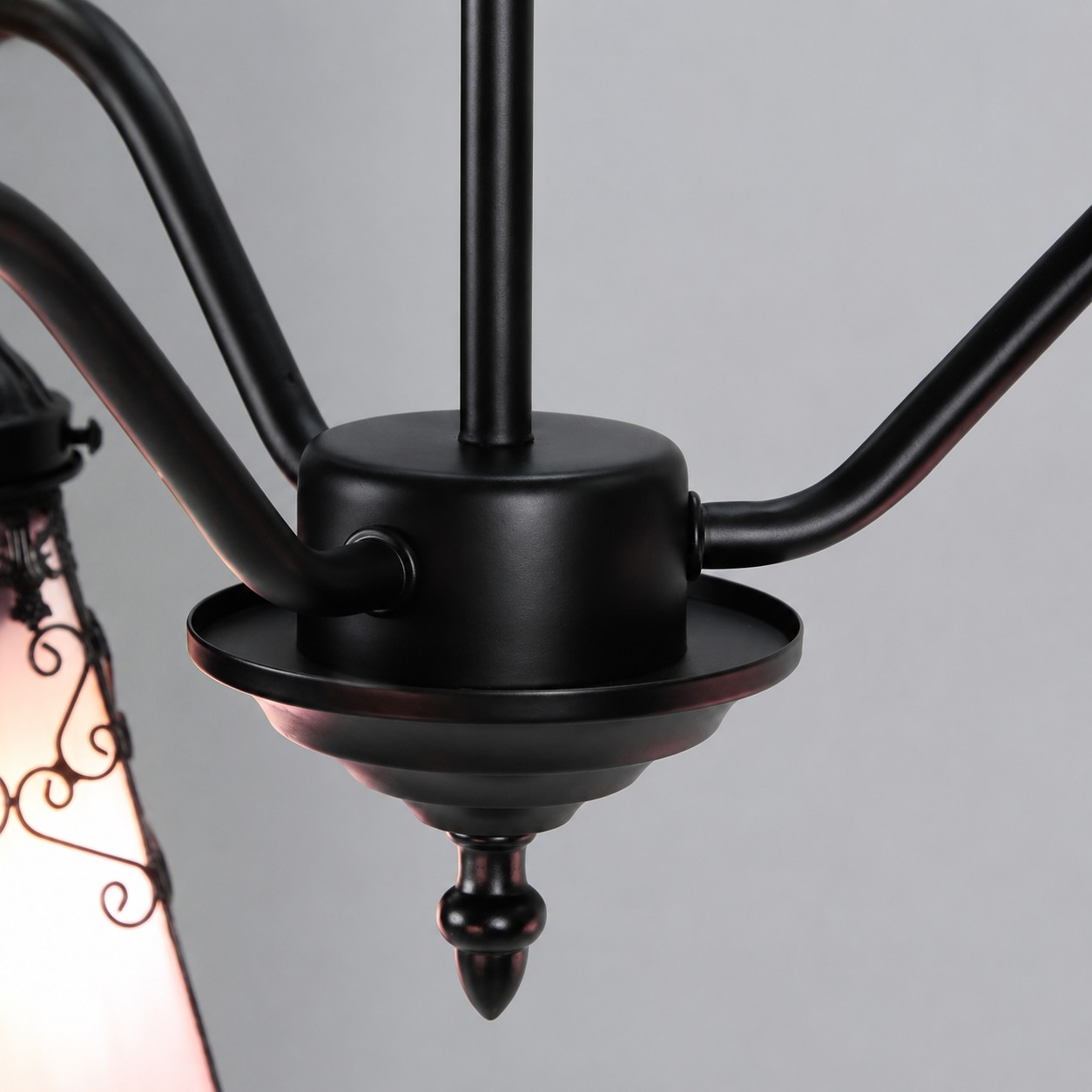 Black iron arm and center hardware detail