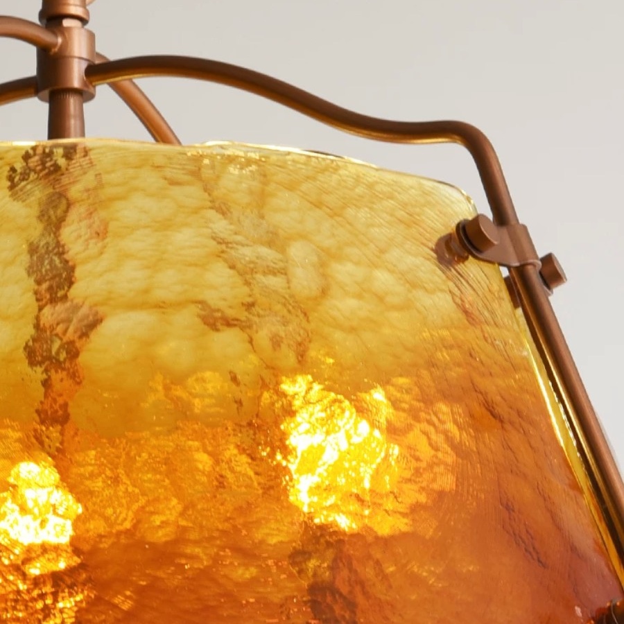Illuminated amber glass texture close-up