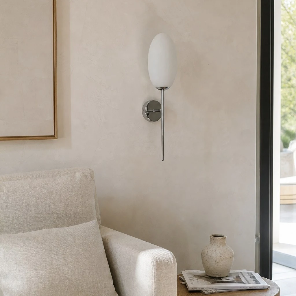 Milk glass wall sconce in a quiet lounge space
