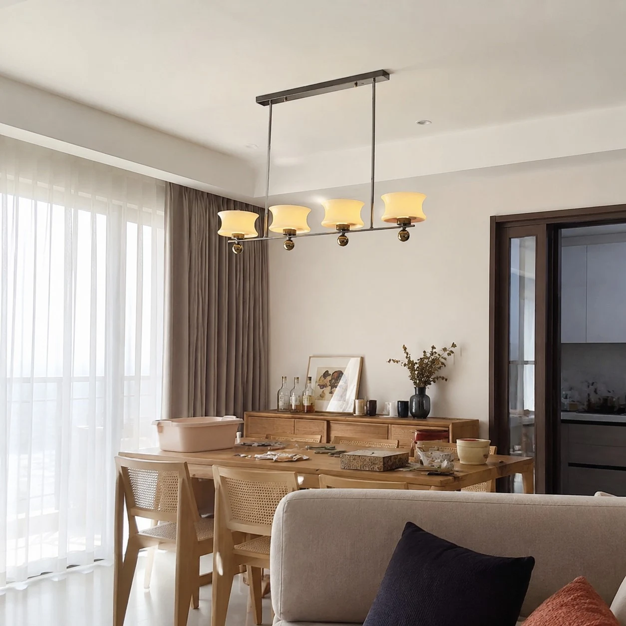 Cream glass chandelier in a relaxed dining and living area