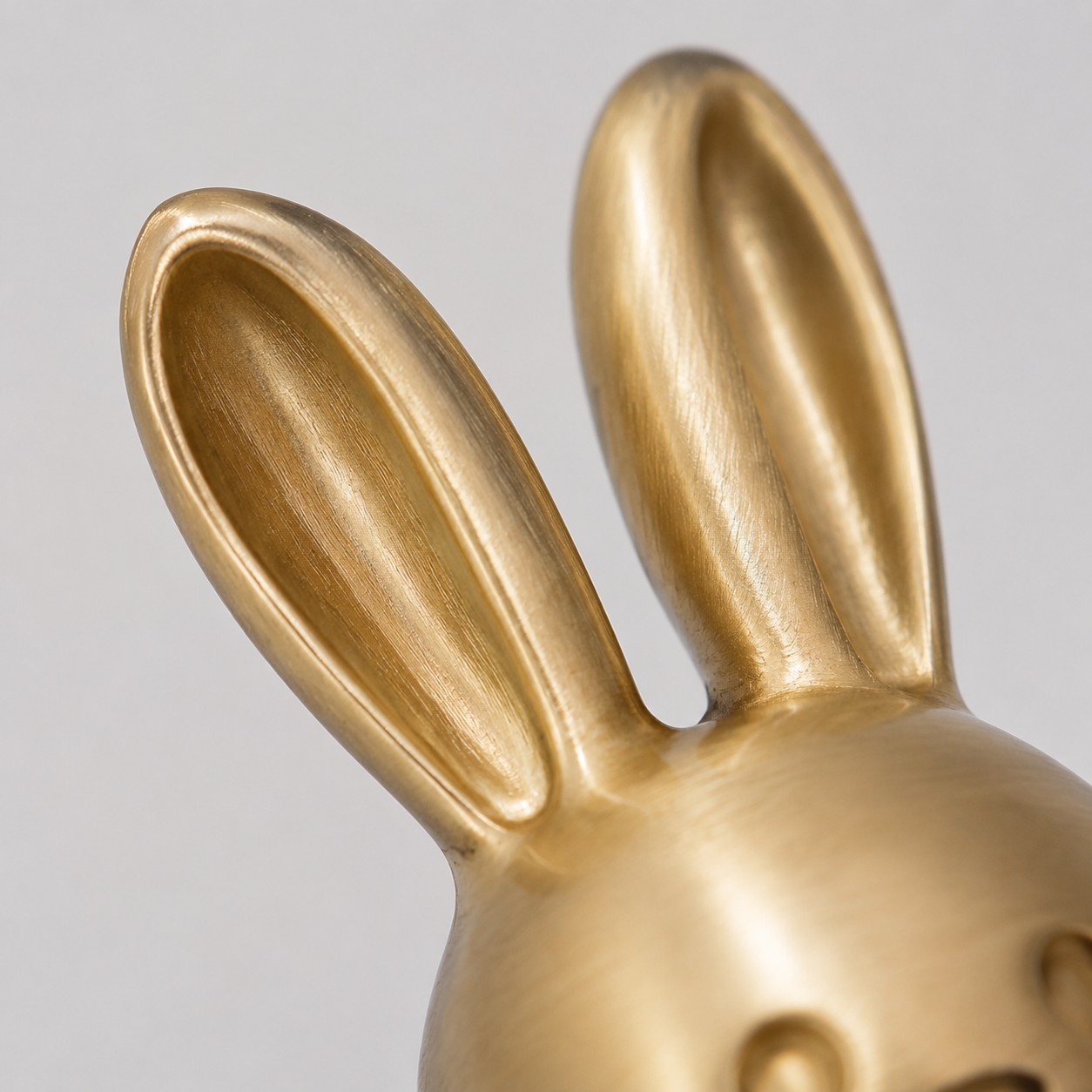 Close view of brass rabbit ear detail
