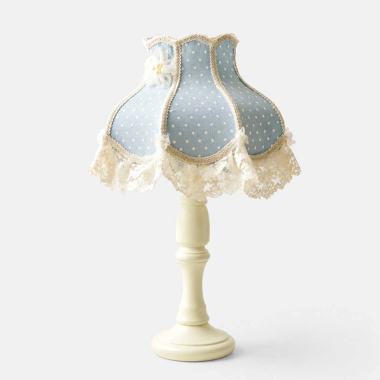 Sky blue floral lace table lamp on a light background