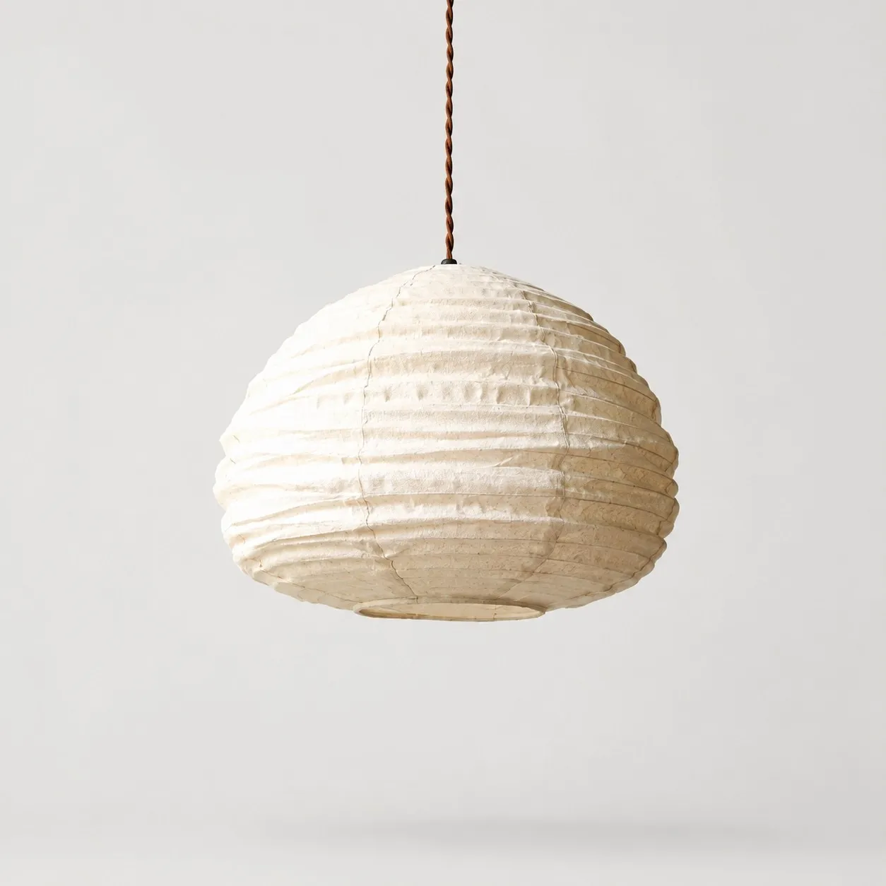 Natural linen wabi-sabi pendant lamp on a light background