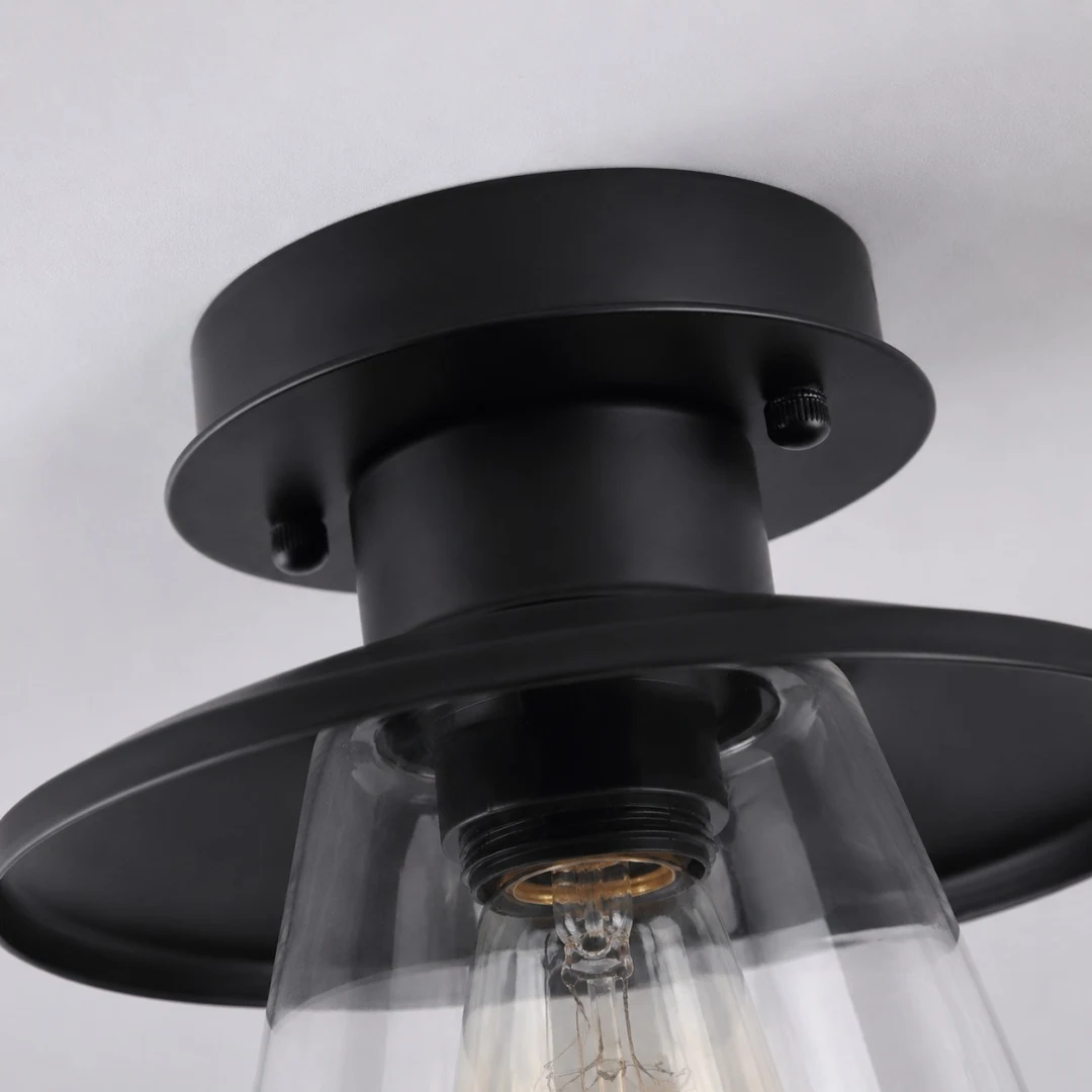 Black metal ceiling canopy and clear glass shade detail