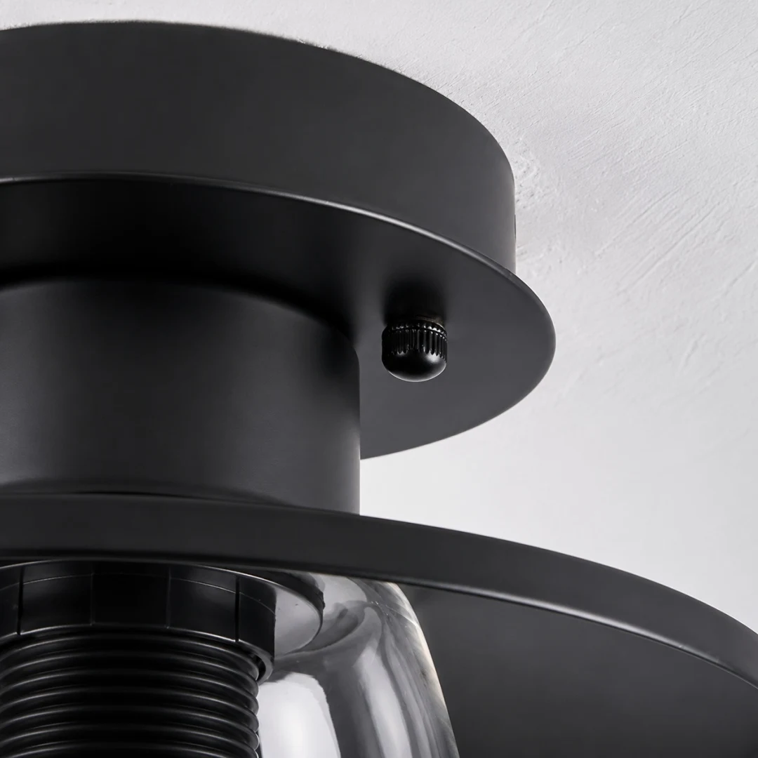 Close view of black metal mount and glass shade